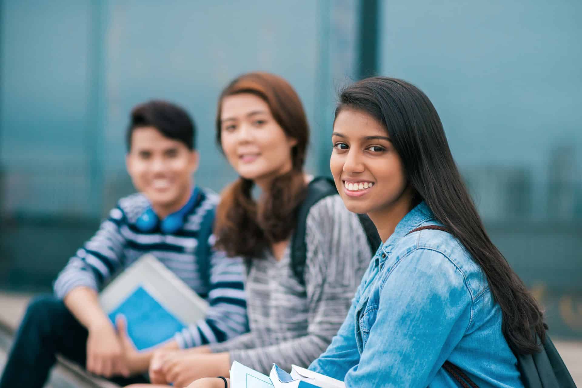 Three teenagers smiling together | Nudera Orthodontics