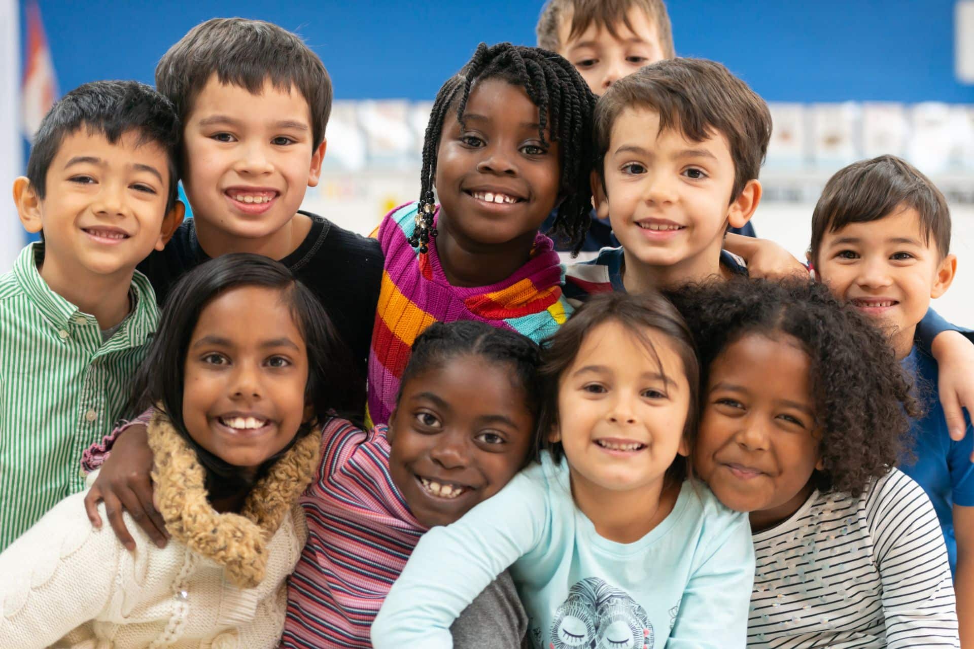 Group of diverse children smiling | Nudera Orthodontics