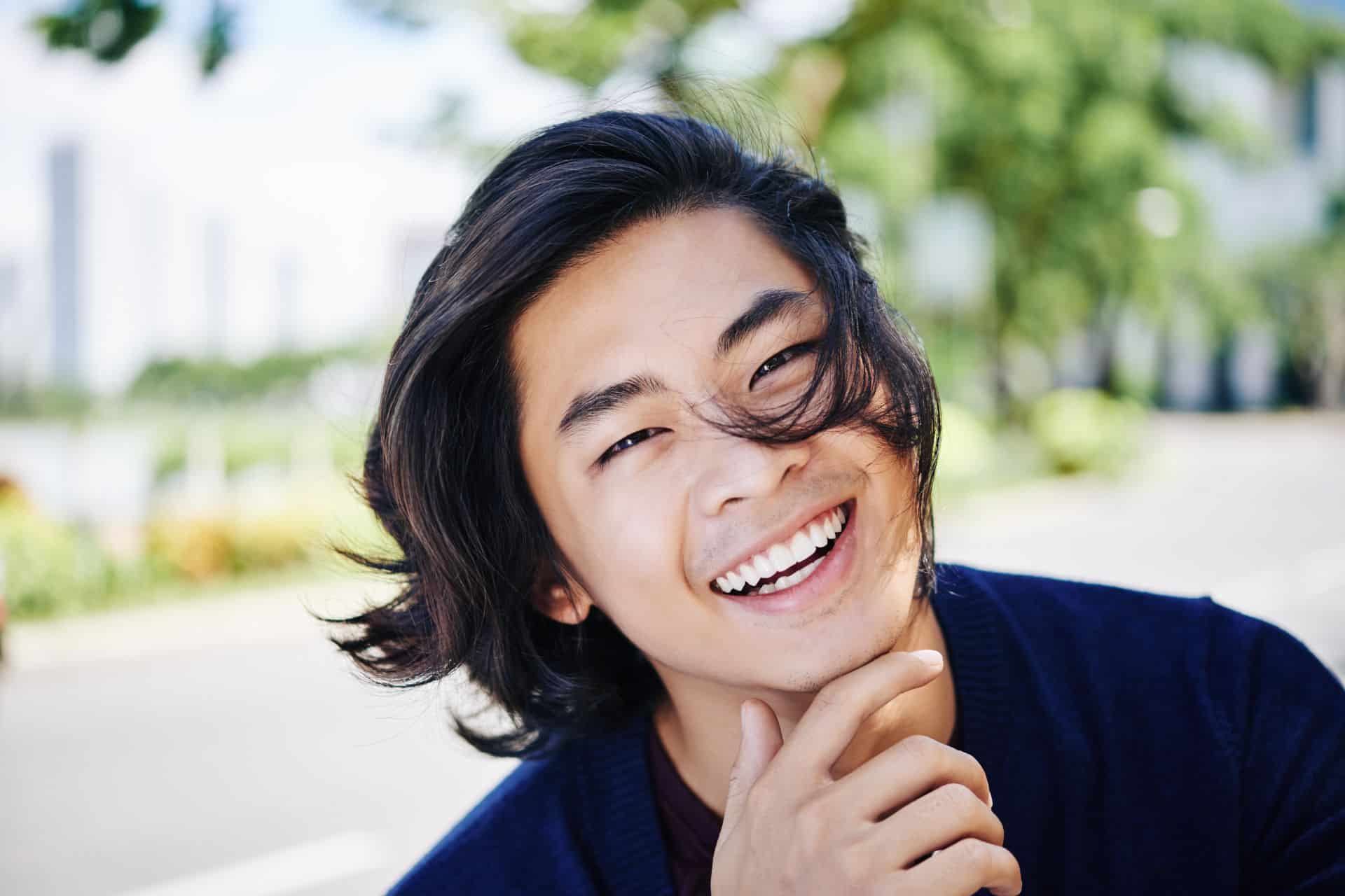 Smiling man with dark hair and mustache | Nudera Orthodontics