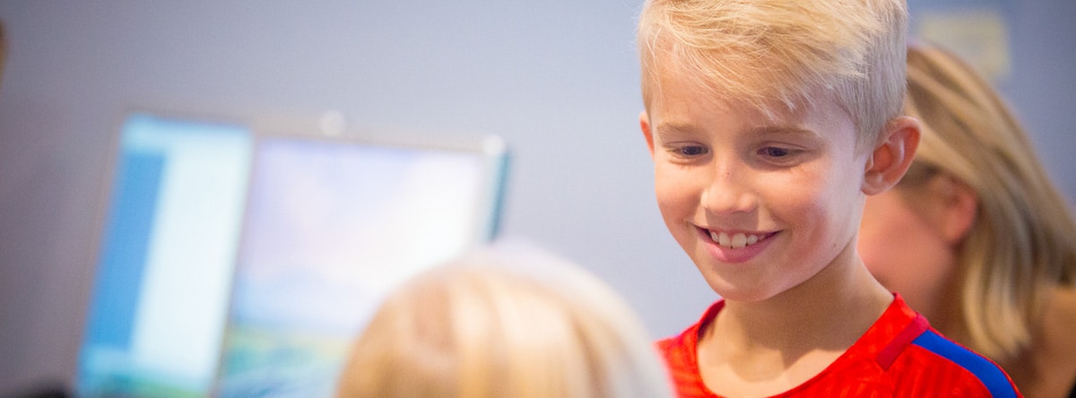 Two young boys smiling together | Nudera Orthodontics