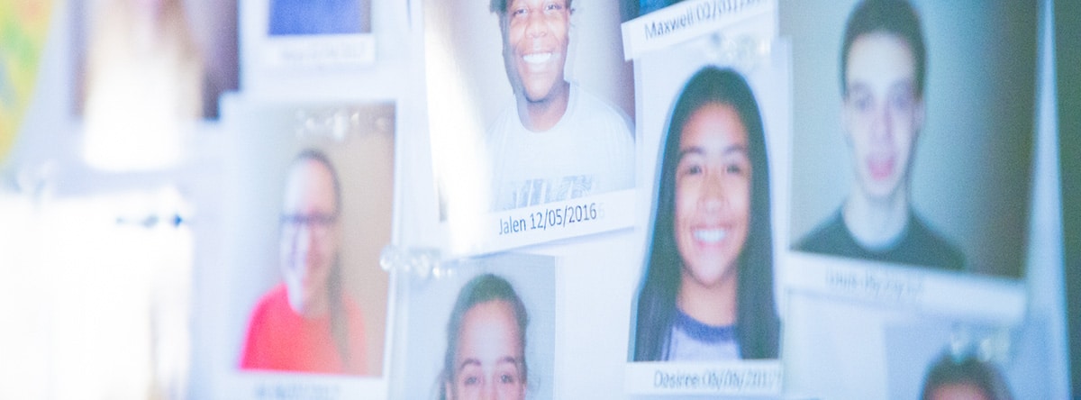 Wall of happy patient photos | Nudera Orthodontics