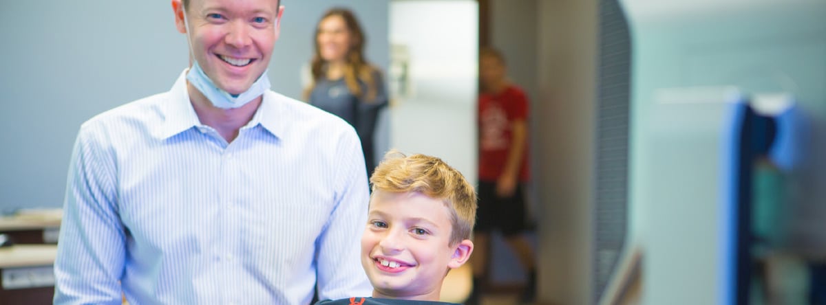 Orthodontist with young boy smiling, Nudera Orthodontics
