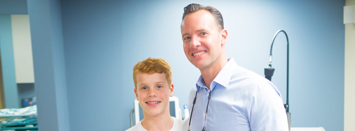 Dr Jim with young boy in white shirt | Nudera Orthodontics
